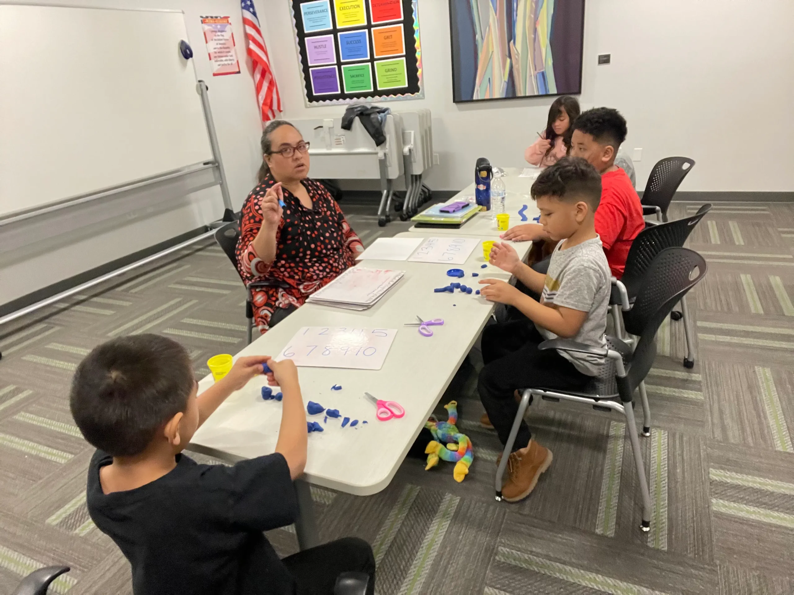 Westbridge Learning Academy Students supported by a teacher